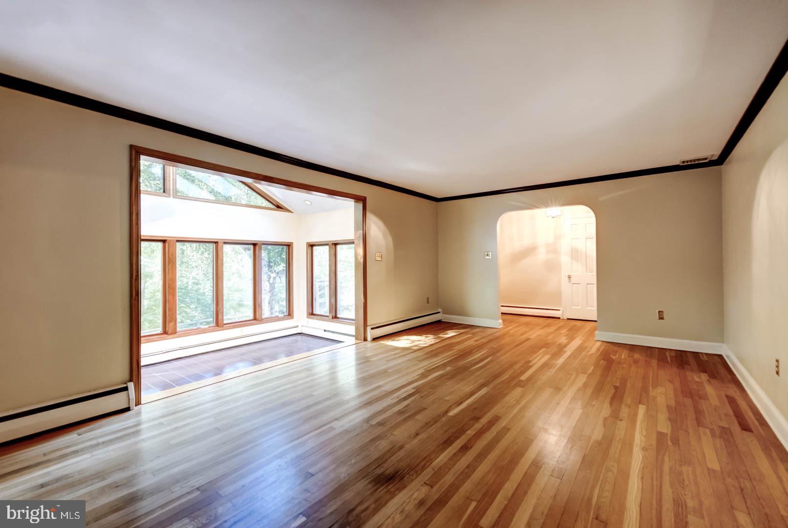 5 Walnut Lane Berwyn, PA 19312 - Photo 6 of 30 an empty room with wooden floor and windows