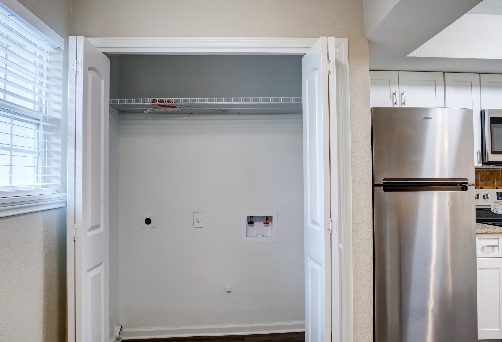9020 Grannis Street, Unit 4 Houston, TX 77075 - Photo 4 of 8 a view of walk in closet with empty racks