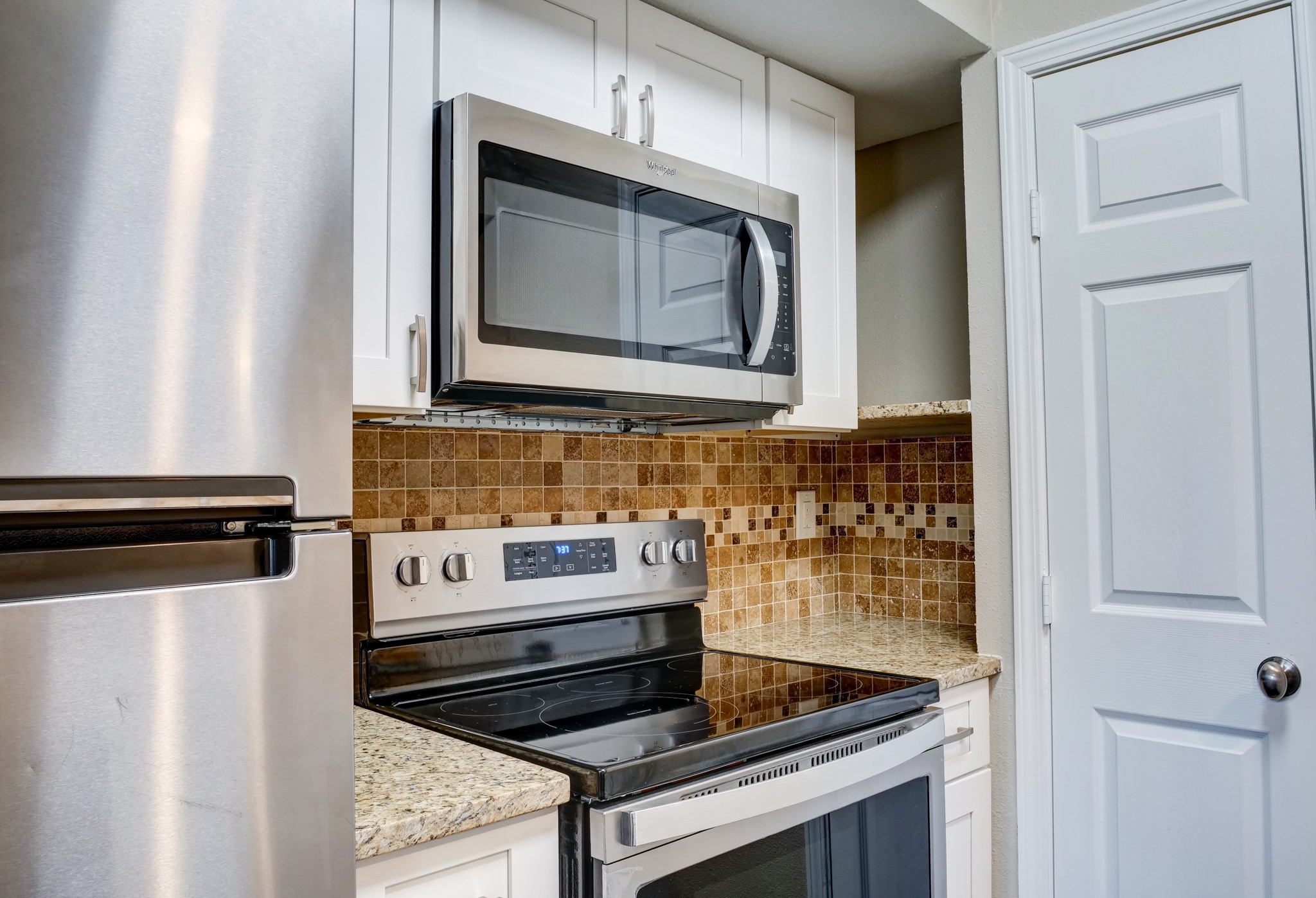 9020 Grannis Street, Unit 4 Houston, TX 77075 - Photo 8 of 8 a stove top oven sitting inside of a kitchen