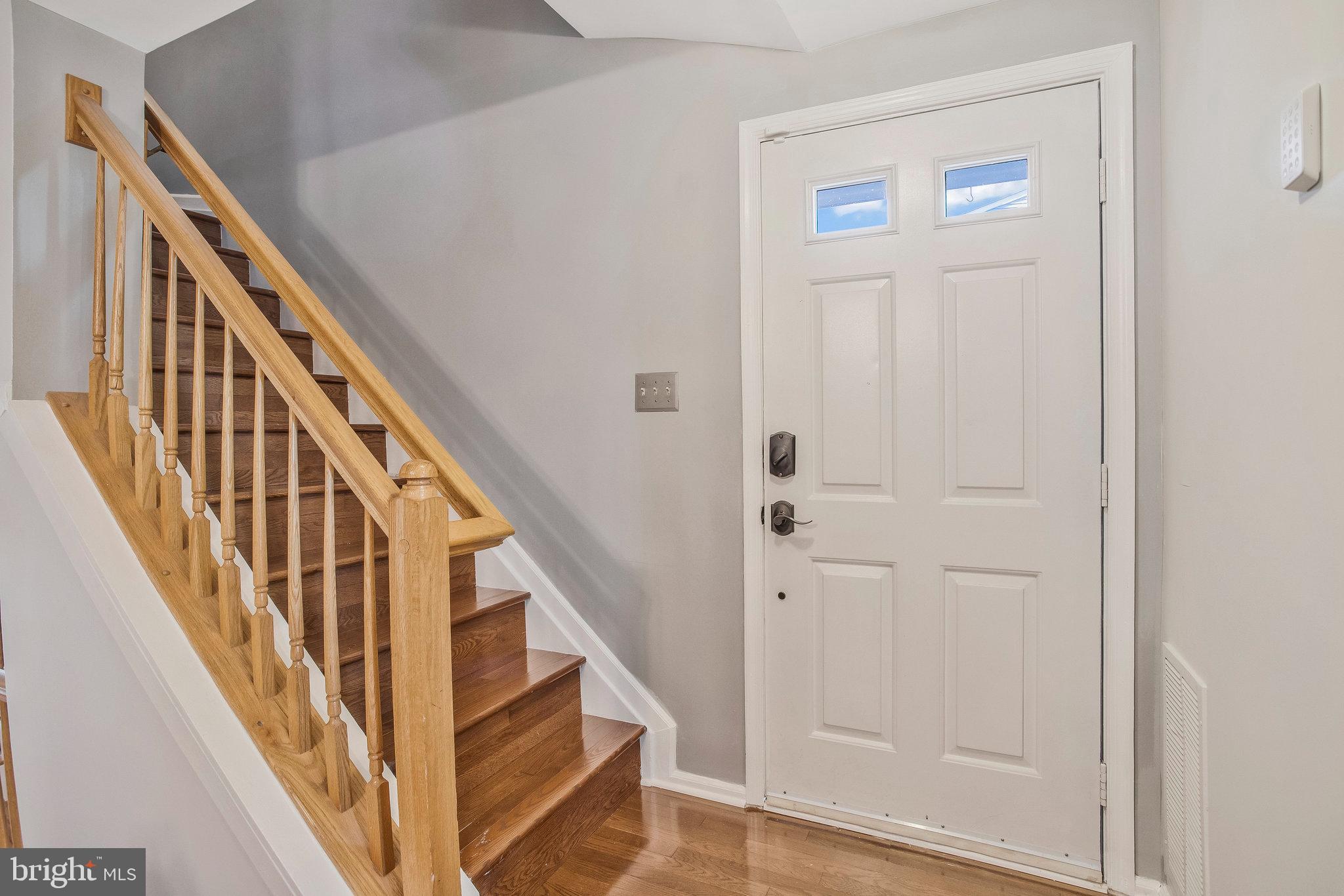 230 Sycamore Ridge Road Laurel, MD 20724 - Photo 15 of 32 Stairs to bedroom level with hardwood flooring.
