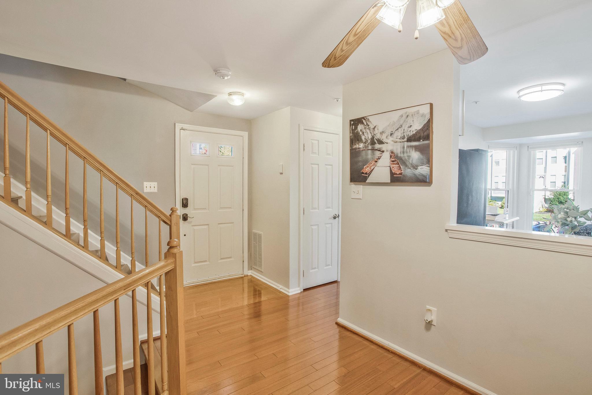 foyer and hall to kitchen and half bath.