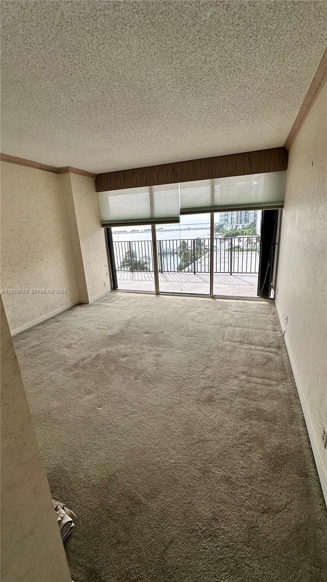 1865 Brickell Avenue, Unit A709 Miami, FL 33129 - Photo 11 of 19 a view of an empty room with a window