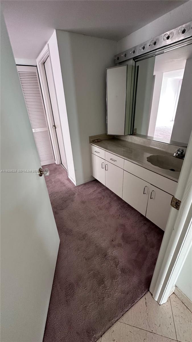 1865 Brickell Avenue, Unit A709 Miami, FL 33129 - Photo 15 of 19 a view of a hardwood floor and staircase