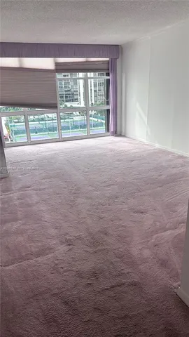 a view of empty room with front door