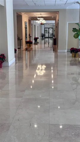 a lobby with furniture and dining room view