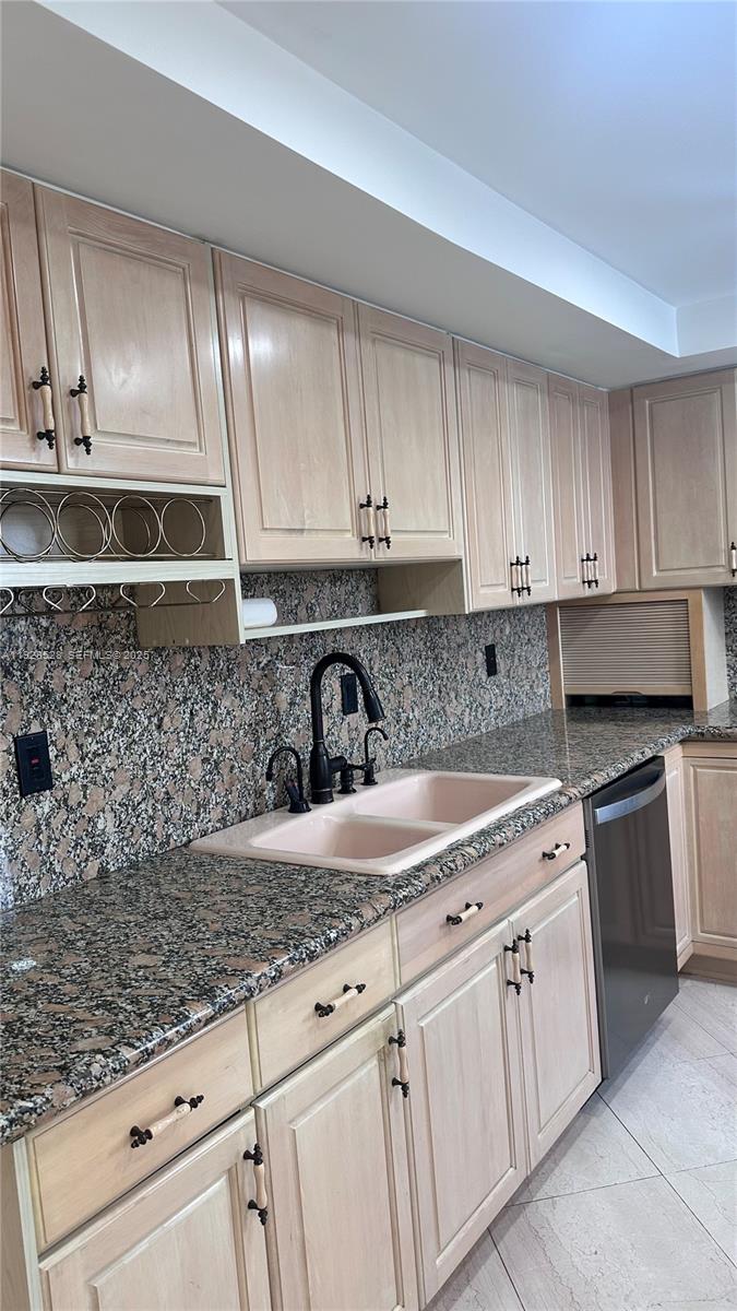 1865 Brickell Avenue, Unit A709 Miami, FL 33129 - Photo 8 of 19 a kitchen with granite countertop white cabinets and white stainless steel appliances