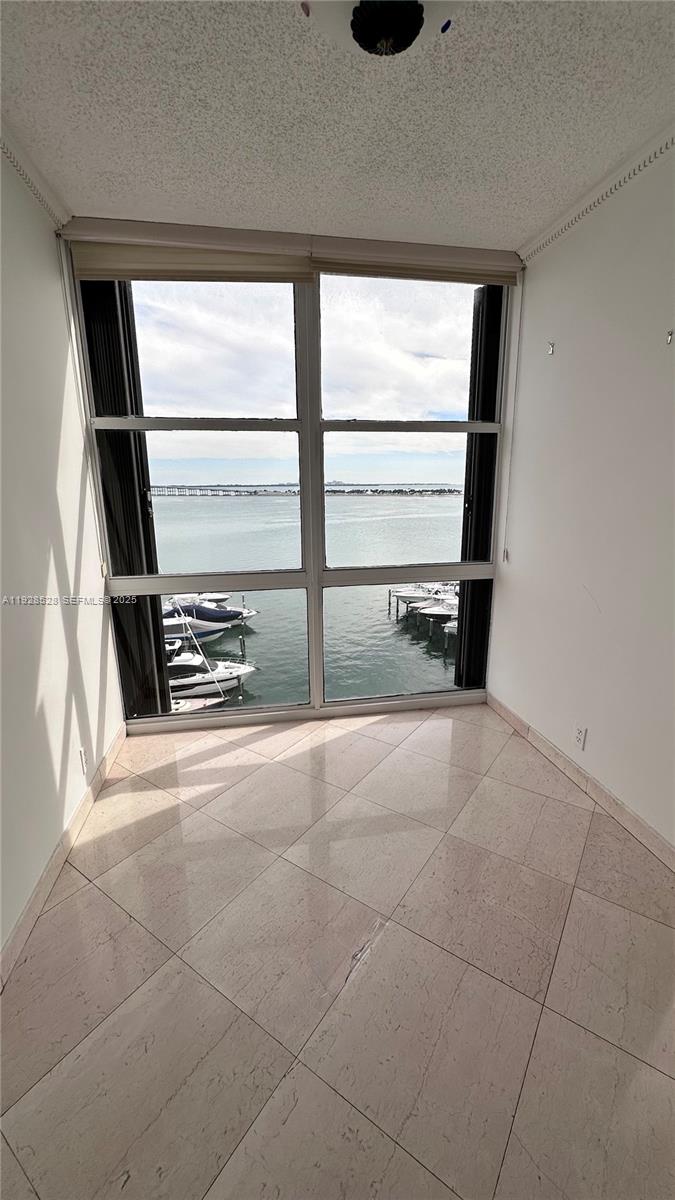 1865 Brickell Avenue, Unit A709 Miami, FL 33129 - Photo 9 of 19 a view of an empty room with a window