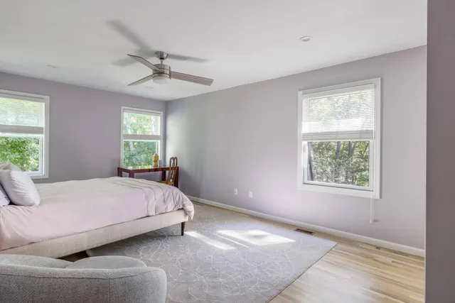 a bedroom with a bed and window