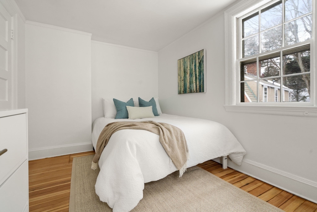 71 Highland Road, Unit 71 Brookline, MA 02445 - Photo 11 of 16 a bedroom with a bed and a window