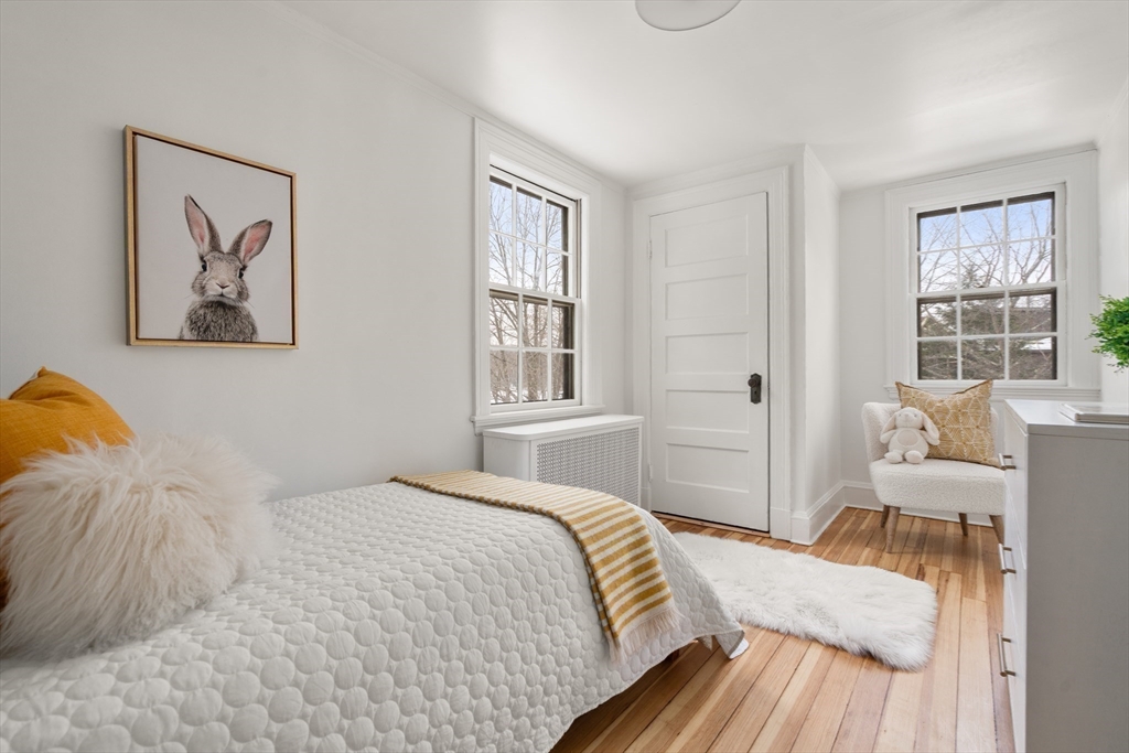 71 Highland Road, Unit 71 Brookline, MA 02445 - Photo 12 of 16 a bedroom with a bed and a window