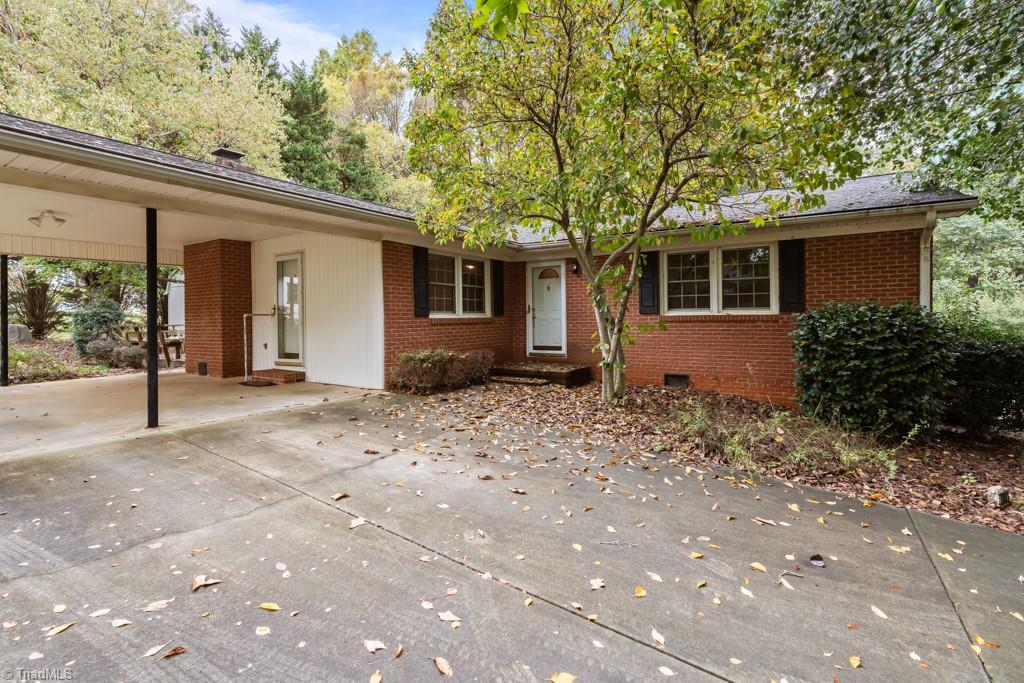 7001 Aplington Road Oak Ridge, NC 27310 - Photo 3 of 34 Attached carport