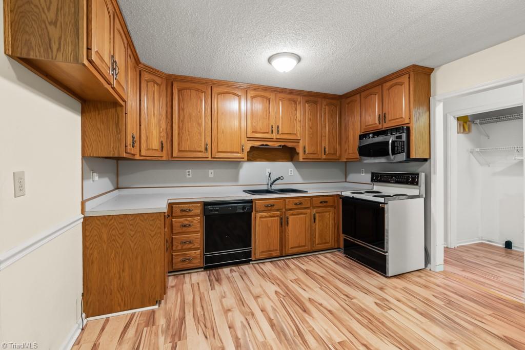 7001 Aplington Road Oak Ridge, NC 27310 - Photo 7 of 34 Plenty of cabinet space