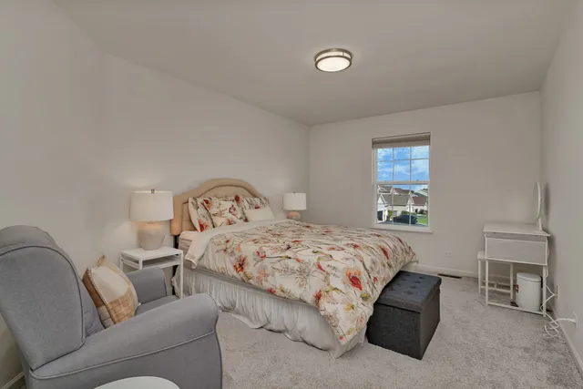 a bedroom with a bed and a couch