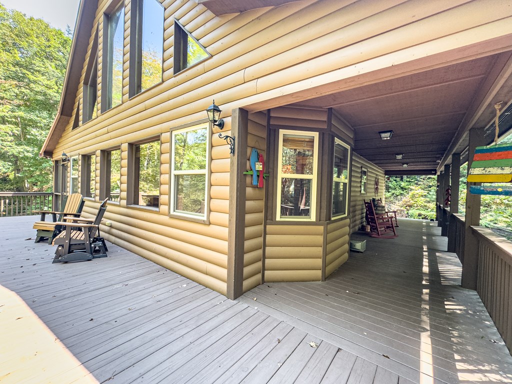 277 Virginia Lane Murphy, NC 28906 - Photo 23 of 62 a view of a porch with wooden floor and furniture