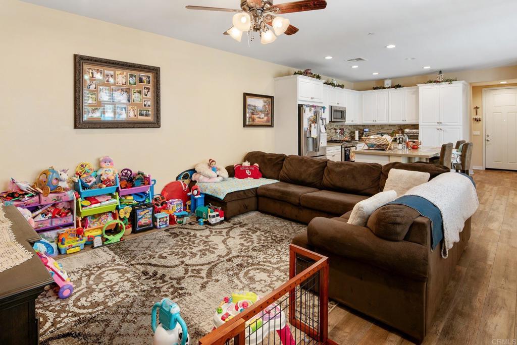 1158 Camino Prado Chula Vista, CA 91913 - Photo 11 of 25 a living room with furniture and kitchen view