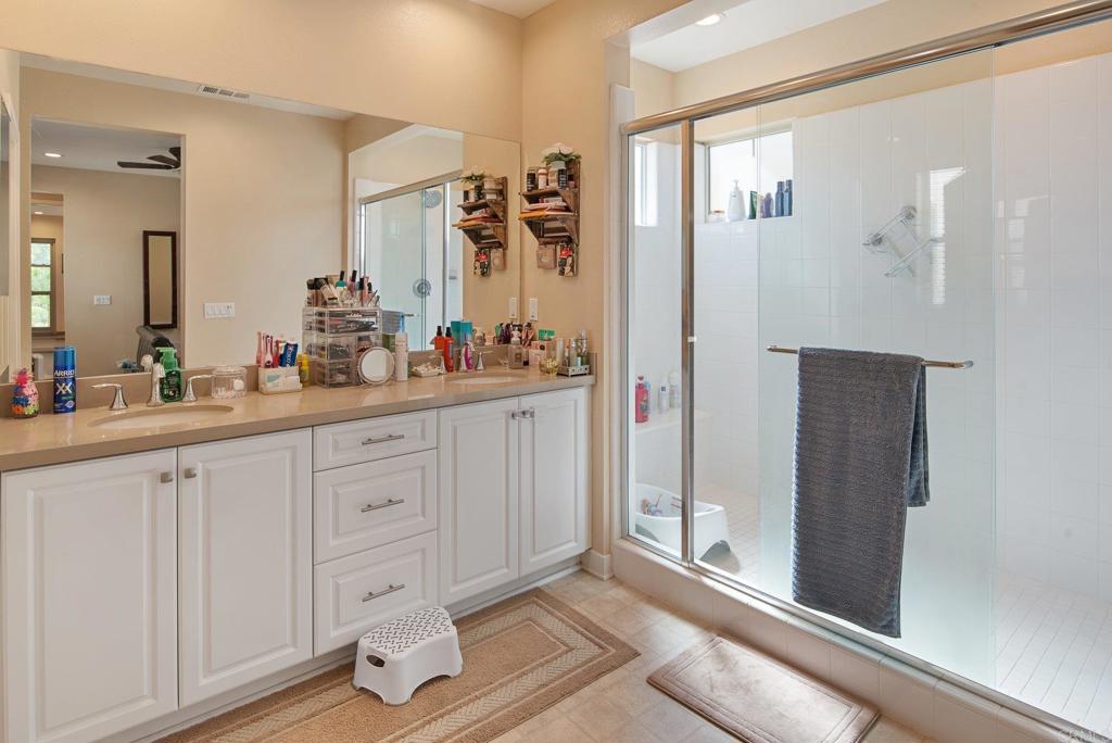 1158 Camino Prado Chula Vista, CA 91913 - Photo 15 of 25 a spacious bathroom with a double vanity sink a mirror and a shower