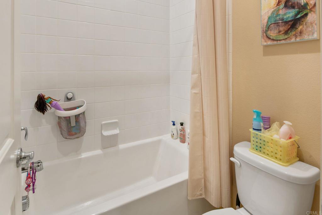 1158 Camino Prado Chula Vista, CA 91913 - Photo 19 of 25 a bathroom with a bathtub and toilet