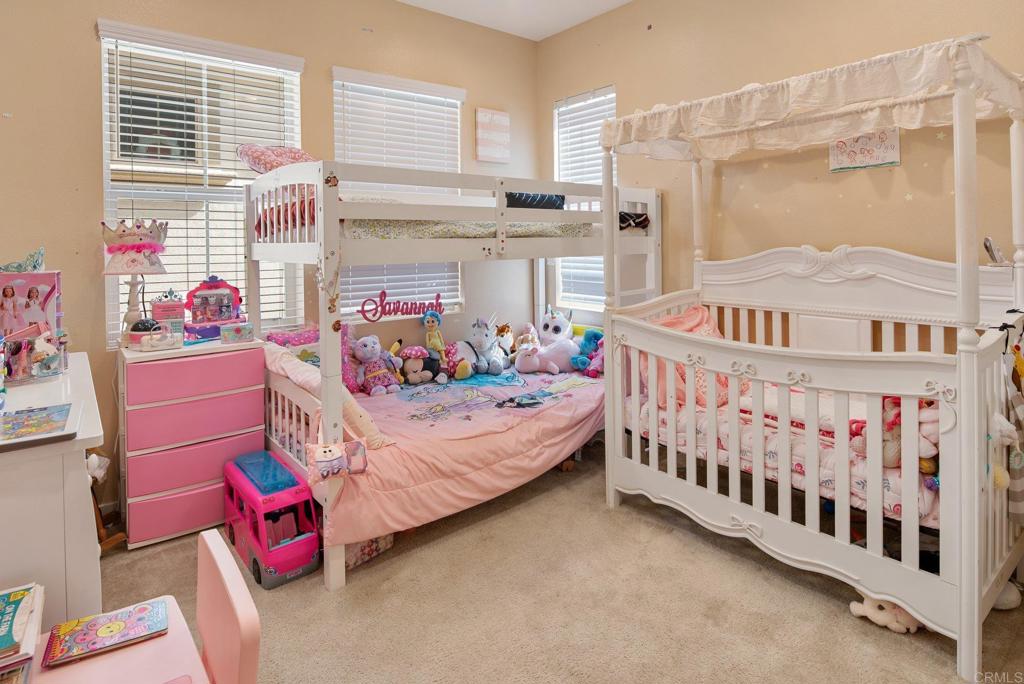 1158 Camino Prado Chula Vista, CA 91913 - Photo 20 of 25 a bedroom with furniture a baby crib and a window