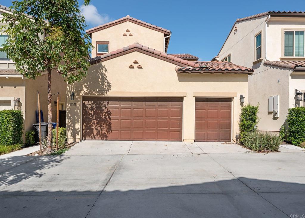 1158 Camino Prado Chula Vista, CA 91913 - Photo 24 of 25 front view of a house with a garage
