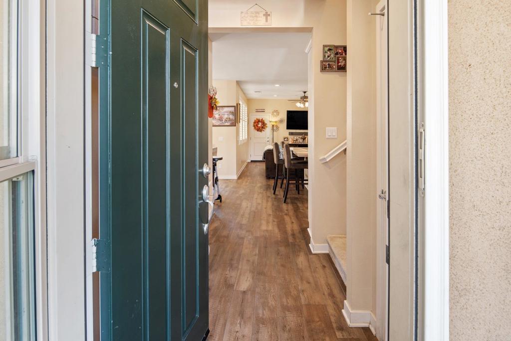 1158 Camino Prado Chula Vista, CA 91913 - Photo 3 of 25 a view of a hallway with wooden floor windows