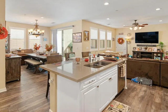 a kitchen with a sink and a stove top oven