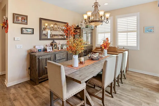 a dining room with furniture and window