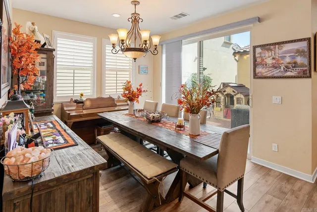 a dining room with furniture and window