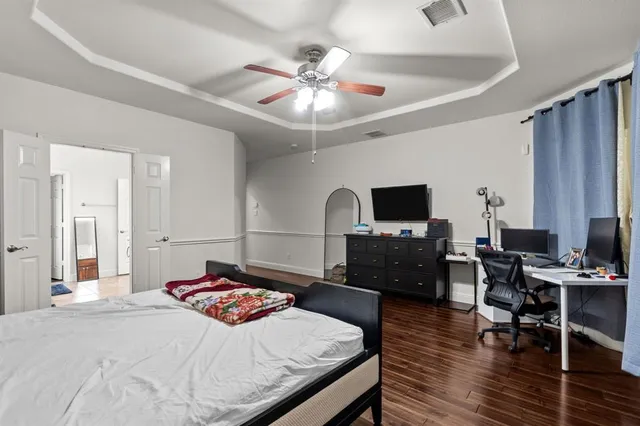 a bathroom with a sink a vanity and a large mirror
