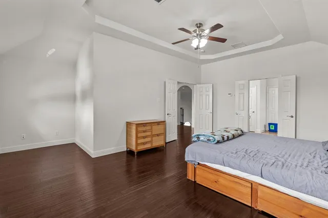 a bedroom with bed and window