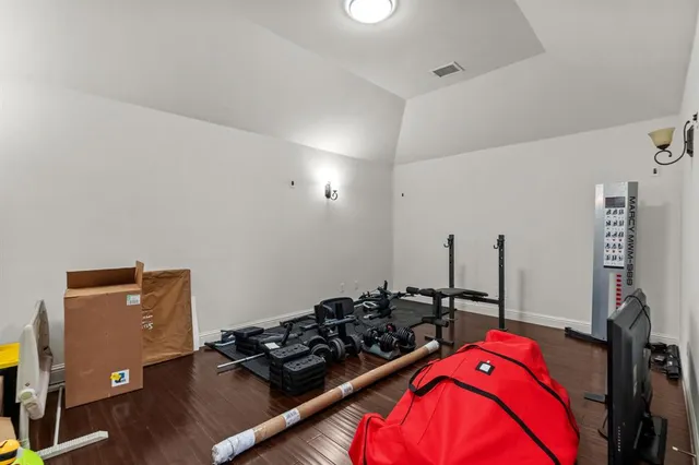 a view of workspace with wooden floor and windows