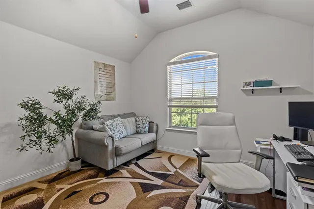 a bedroom with a bed and a table in it