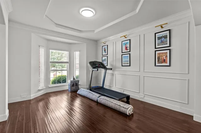 a view of room with gym equipment and a window