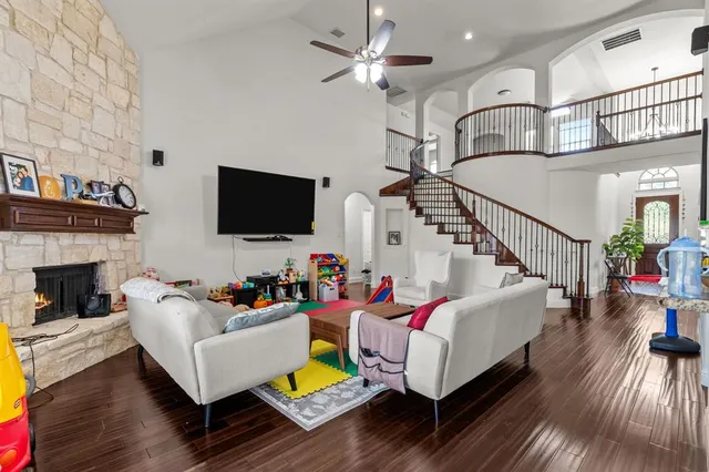 a living room with furniture fireplace and flat screen tv