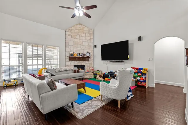 a living room with furniture and a flat screen tv