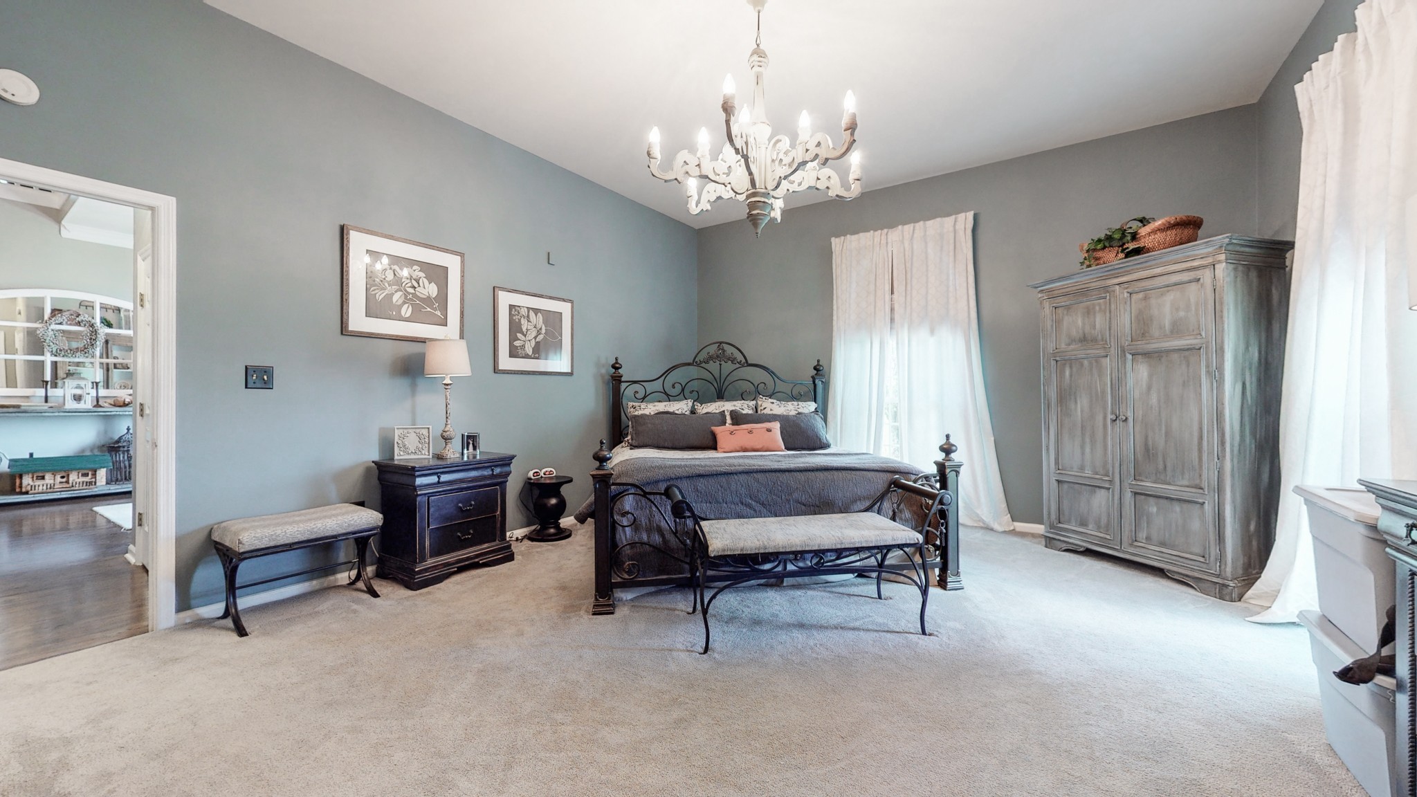 411 Squire Hall Road Bell Buckle, TN 37020 - Photo 22 of 50 a bedroom with furniture and a chandelier