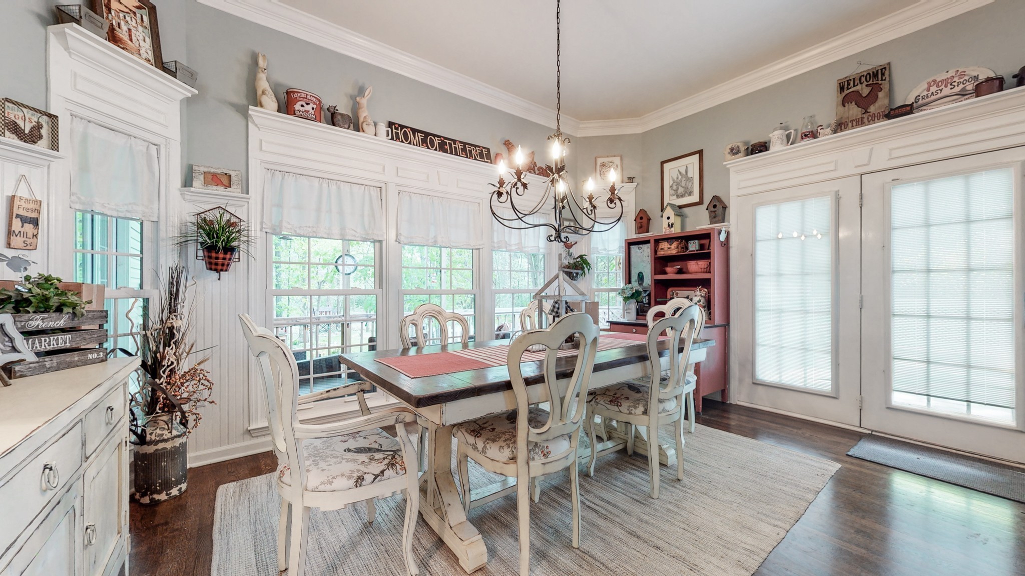 411 Squire Hall Road Bell Buckle, TN 37020 - Photo 9 of 50 a view of a dining room with furniture wooden floor and chandelier