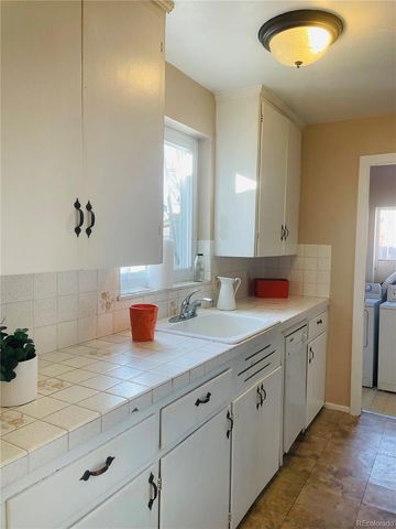 a spacious bathroom with double sink and a mirror
