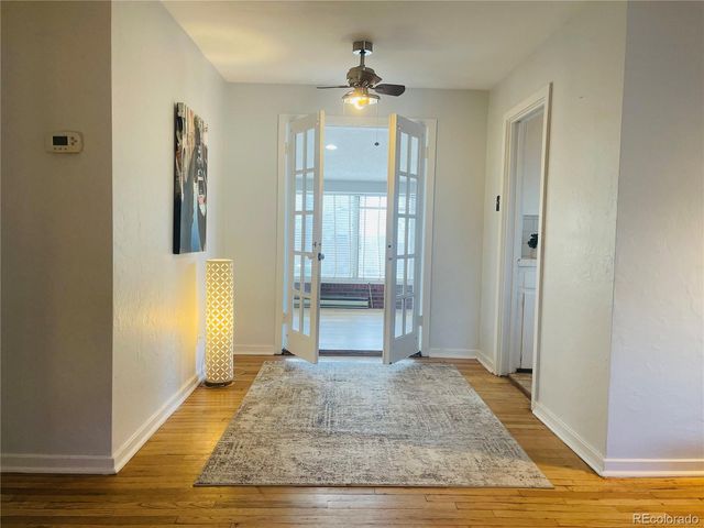 a view of an entryway with a chandelier