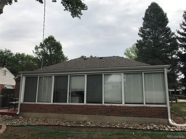 a view of a house with a small yard