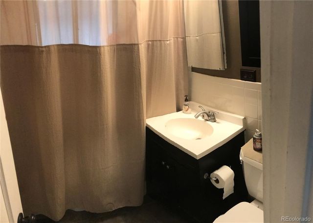 a bathroom with a sink and mirror