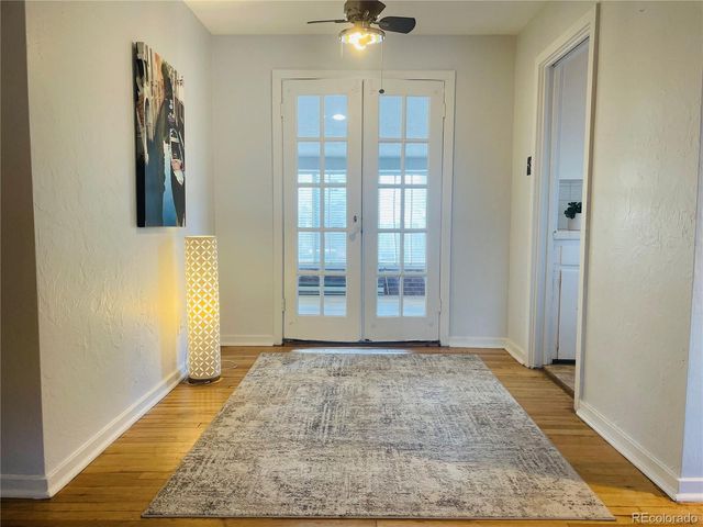a view of hallway with windows and stairs