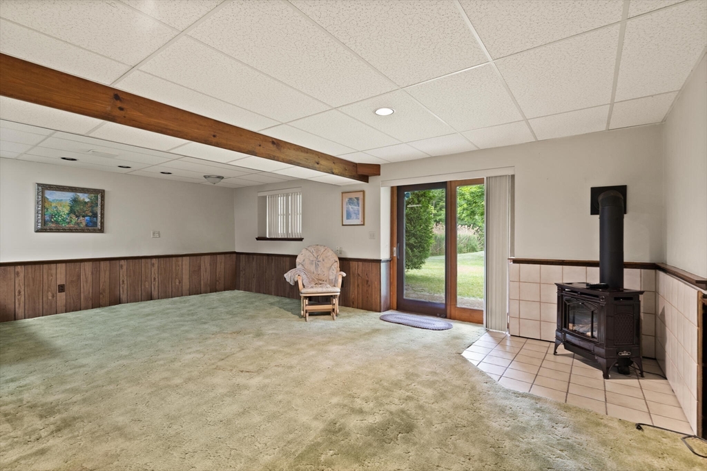 115 Village Post Road, Unit 115 Danvers, MA 01923 - Photo 24 of 36 a view of a livingroom with furniture and a window
