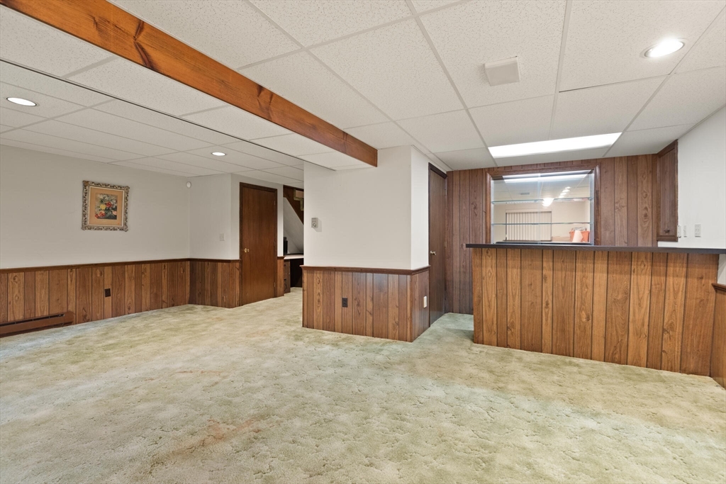 115 Village Post Road, Unit 115 Danvers, MA 01923 - Photo 25 of 36 a view of an empty room with a window