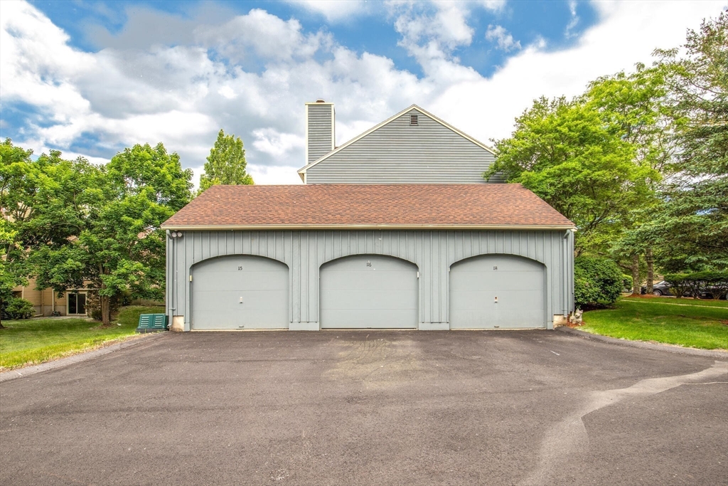 115 Village Post Road, Unit 115 Danvers, MA 01923 - Photo 28 of 36 a house view with a garden
