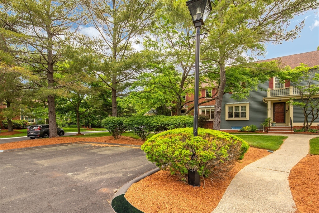 115 Village Post Road, Unit 115 Danvers, MA 01923 - Photo 3 of 36 a backyard of a house with yard and outdoor seating