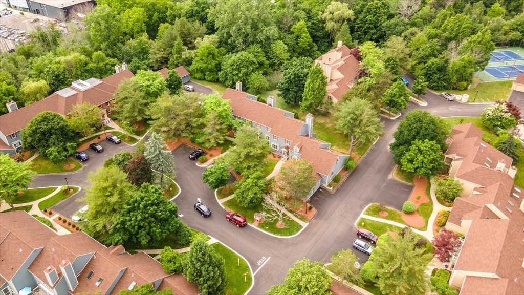 115 Village Post Road, Unit 115 Danvers, MA 01923 - Photo 33 of 36 an aerial view of a house with a yard and lake view