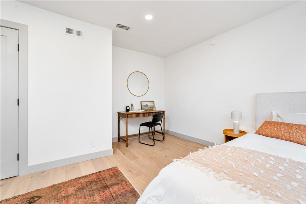 3383 Marigold Circle Costa Mesa, CA 92626 - Photo 31 of 43 a bedroom with a bed a desk and chair