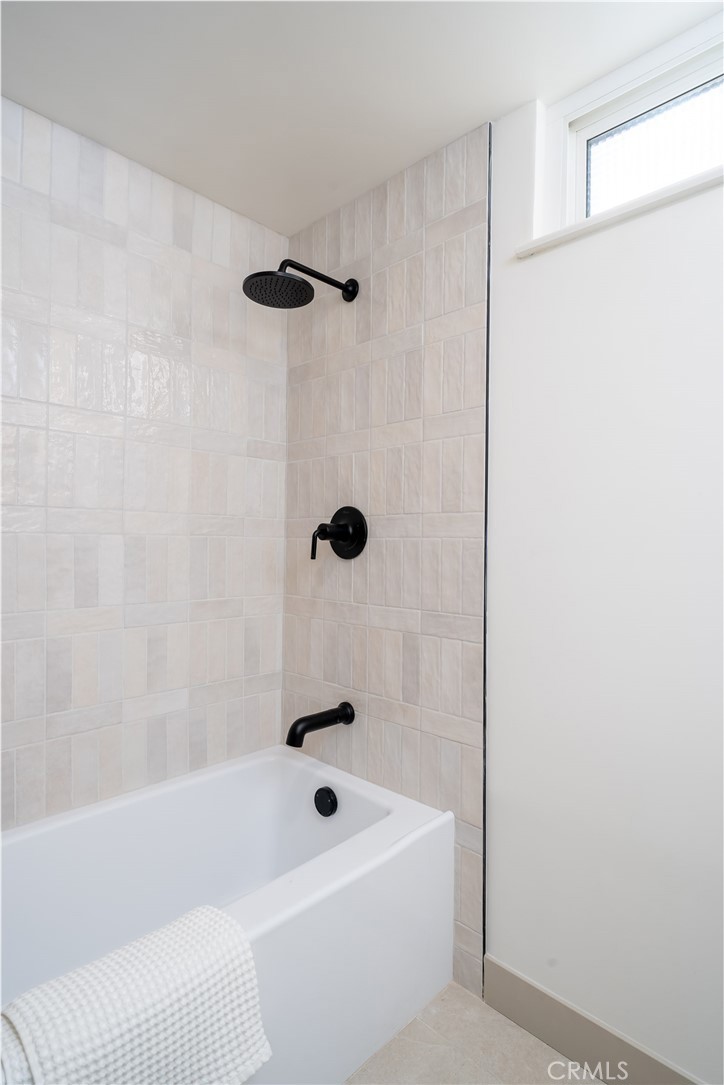 3383 Marigold Circle Costa Mesa, CA 92626 - Photo 33 of 43 a bathroom with a bathtub and shower