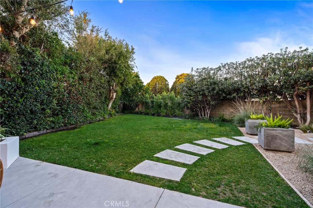 3383 Marigold Circle Costa Mesa, CA 92626 - Photo 39 of 43 a view of a garden with a tree in the background