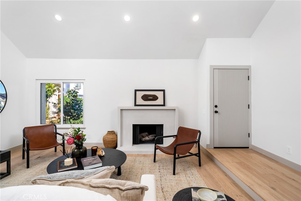 3383 Marigold Circle Costa Mesa, CA 92626 - Photo 6 of 43 a living room with furniture and a fireplace